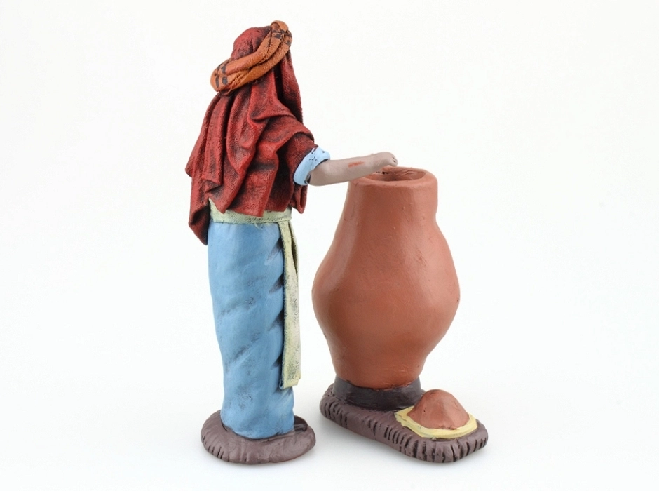 Grupo alfarero modelando una tinaja 14 cm.
