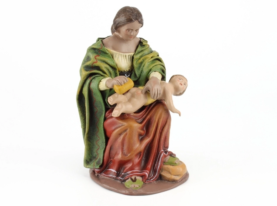 Madre lavando al niño 17 cm. Madre lavando al niño 17 cm.