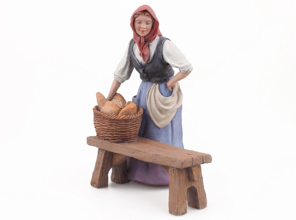 Mujer con cesta de pan en el banco 15 cm.