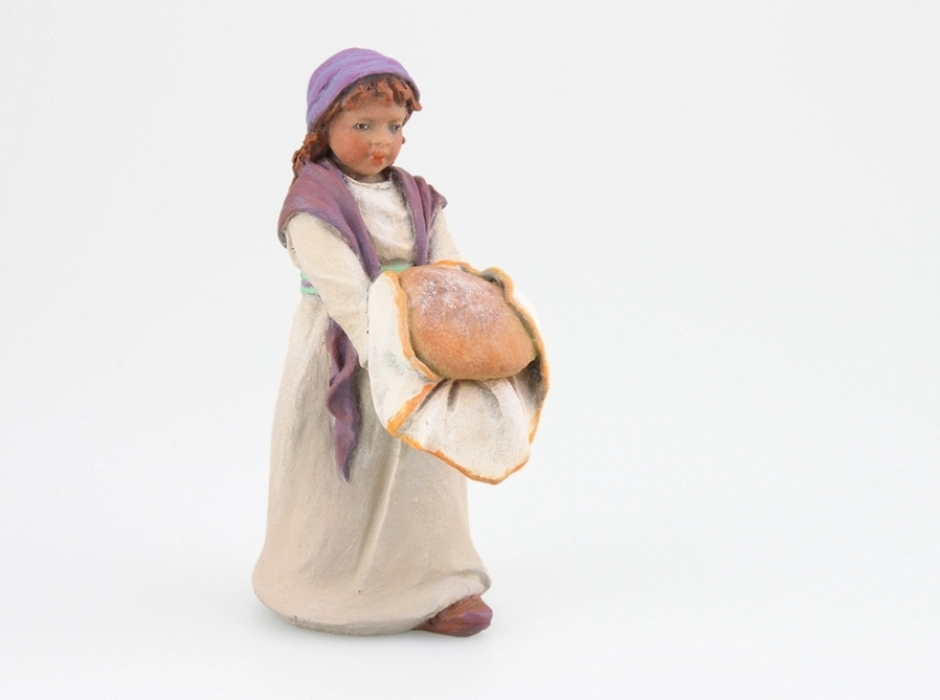 Niña con pan 12 cm.