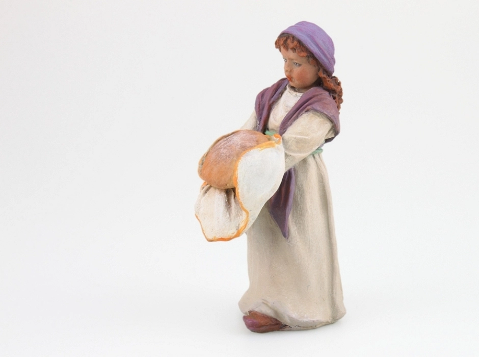 Niña con pan 12 cm.
