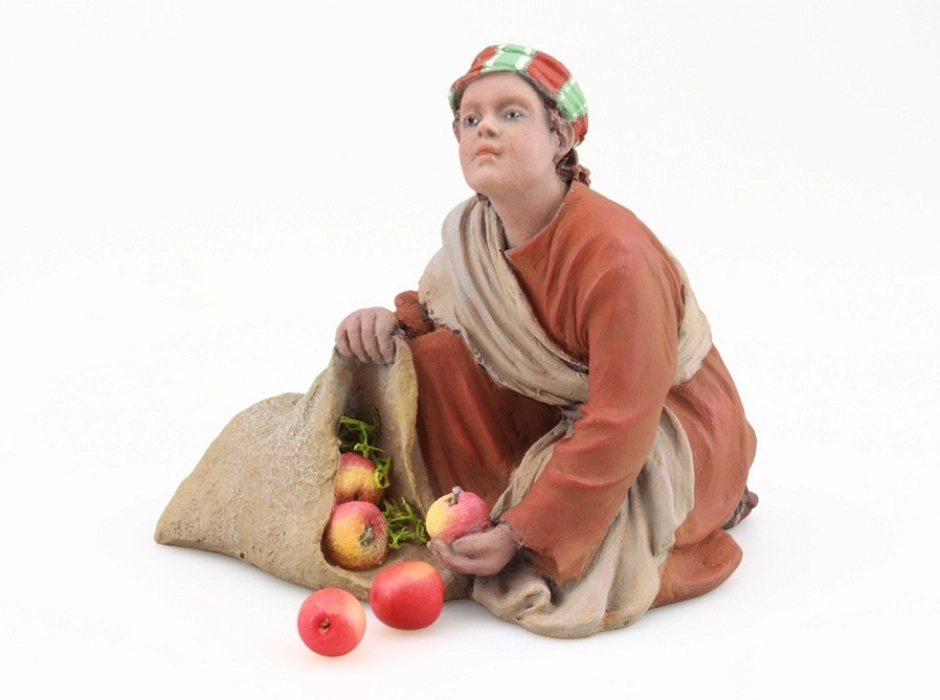 Niño con saco de manzanas 17 cm. Niño con saco de manzanas 17 cm.