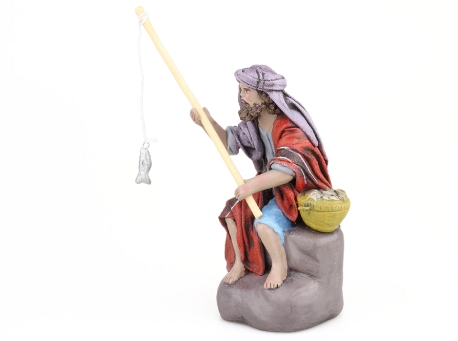 Pescador sobre rocas 12 cm.