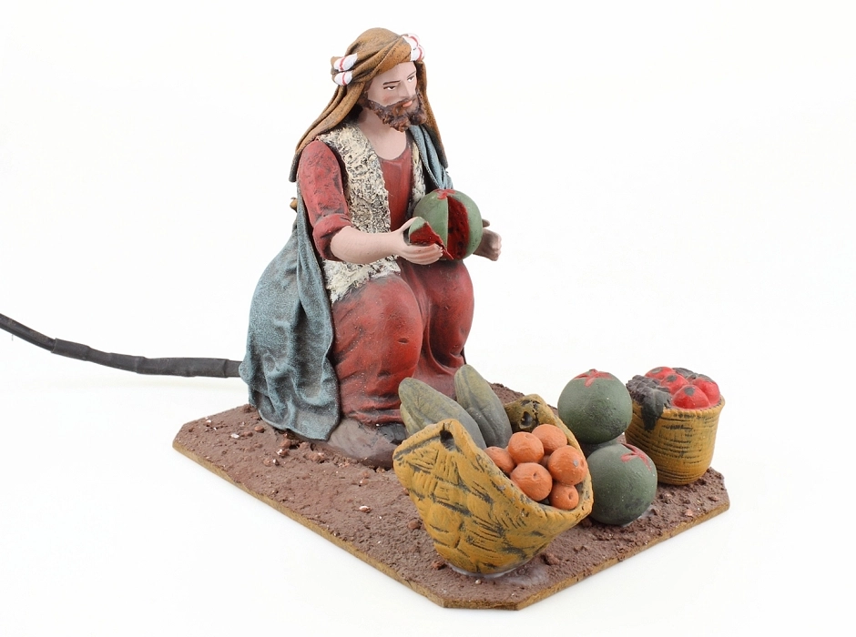 Vendedor de fruta con movimiento 17 cm. 220V.
