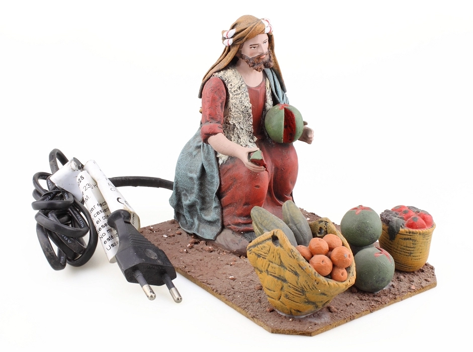 Vendedor de fruta con movimiento 17 cm. 220V. Vendedor de fruta con movimiento 17 cm. 220V.